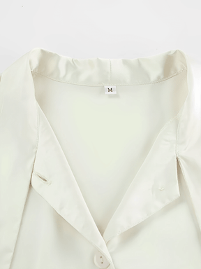 Camisa Feminina Acetinada com Gola Laço e Manga Longa Flare – Betania