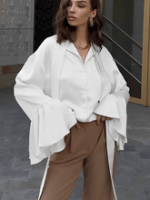 Camisa Feminina Acetinada com Gola Laço e Manga Longa Flare – Betania